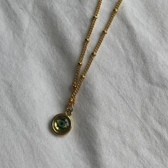 Gold eye necklace with green - Picture 1 of 3